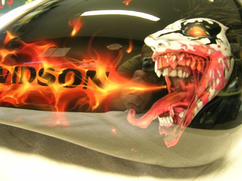 2010 Harley-Davidson Electra Glide - Custom airbrushed motorcycle gas tank features a monstrous face with flames and "HARLEY-DAVIDSON" lettering.