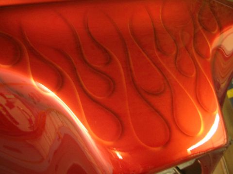 2010 Harley-Davidson Electra Glide - A close-up view of a vehicle's painted surface custom flame graphics. The "Supermotors" watermark is visible.