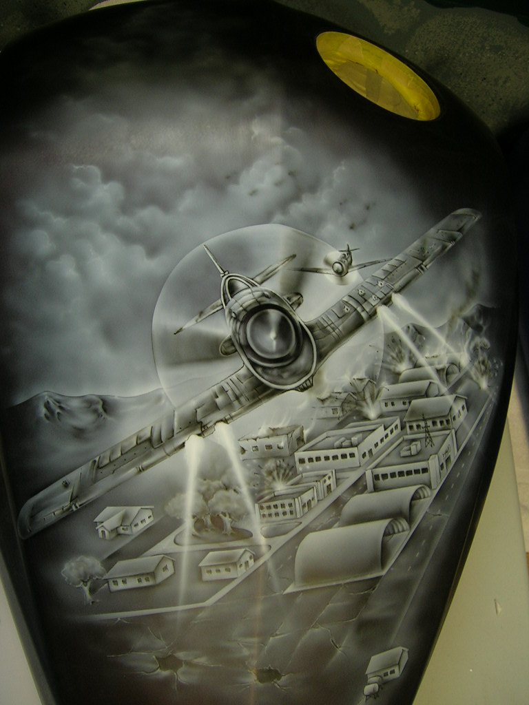 Airbrushed warplane bombing a village, grayscale custom paint art