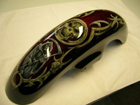 2010 Harley-Davidson Electra Glide - A custom painted motorcycle fender features a grim reaper and skull design with tribal accents on a dark red background.