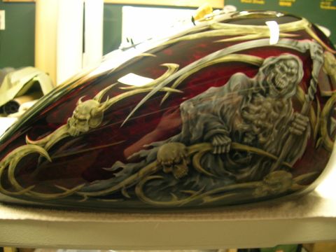 2010 Harley-Davidson Electra Glide - Custom painted motorcycle gas tank features a grim reaper and skull design with a dark red and gold color scheme.