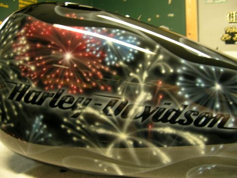 2010 Harley-Davidson Electra Glide - Fuel tank features a custom paint job with fireworks and the Harley-Davidson logo.