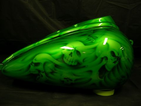 2010 Harley-Davidson Electra Glide - Motorcycle gas tank with custom airbrushed skull graphics in green.