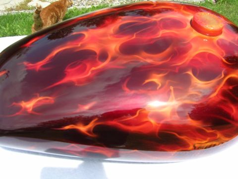 2010 Harley-Davidson Electra Glide - A motorcycle gas tank features a custom flame paint job in shades of red and orange.