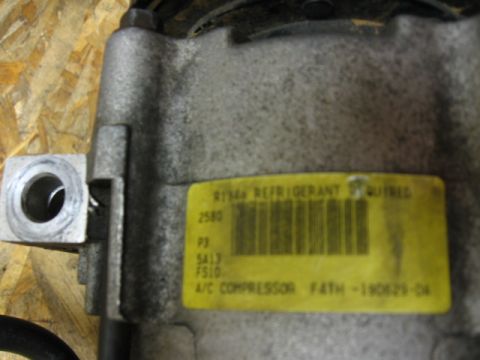 1995 Ford Bronco - This is a close-up of an AC compressor, not a 1995 Ford Bronco.