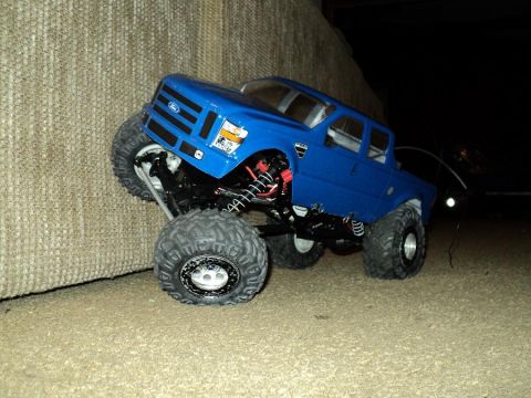 2008 Ford F-250 - A blue 2008 Ford F-250 remote control truck is shown from a three-quarter front angle.