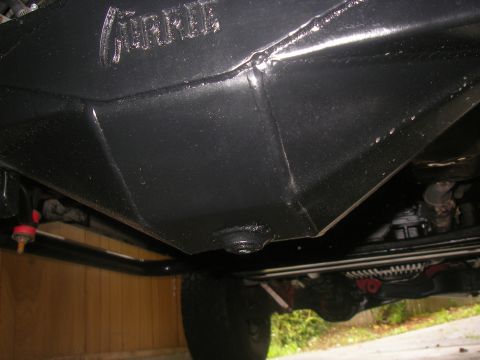 1990 Ford Bronco - Underside view of a vehicle, highlighting the Currie F9 differential and related parts.