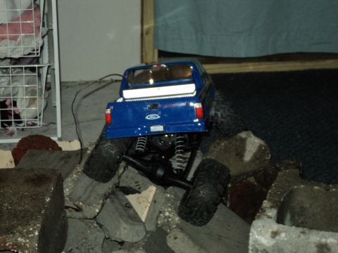 2008 Ford F-250 - This remote-controlled truck is navigating a rocky terrain.