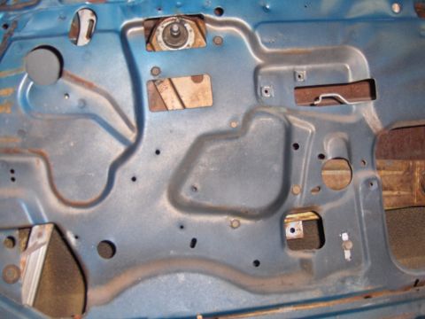 1970 Chevrolet Camaro - Interior door panel of a car, showing rust and various mounting points.