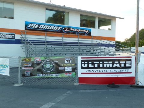 1992 Ford Mustang - Grandstands and advertising banners at Piedmont Dragway.