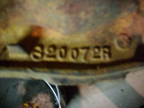 1994 Ford Bronco - Stamped numbers are visible on a rusty metal component, possibly a part number or identification mark.
