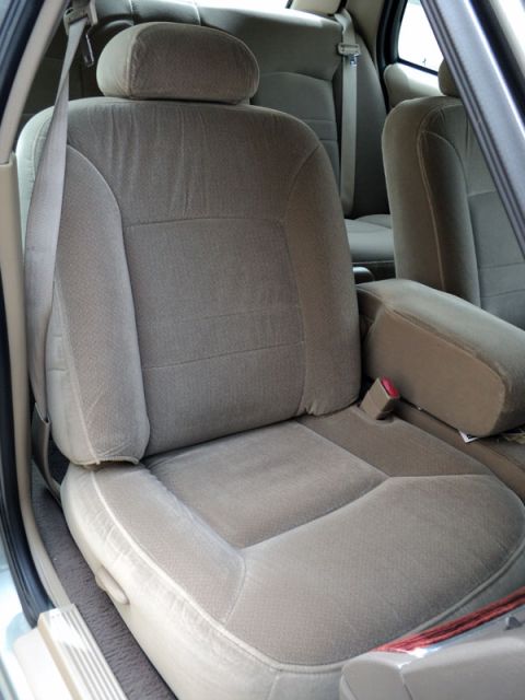 2001 Mercury Grand Marquis - Interior view of car seats and armrest.