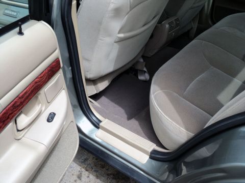2001 Mercury Grand Marquis - Interior view of a 2001 Mercury Grand Marquis, focusing on the passenger and rear seating areas.