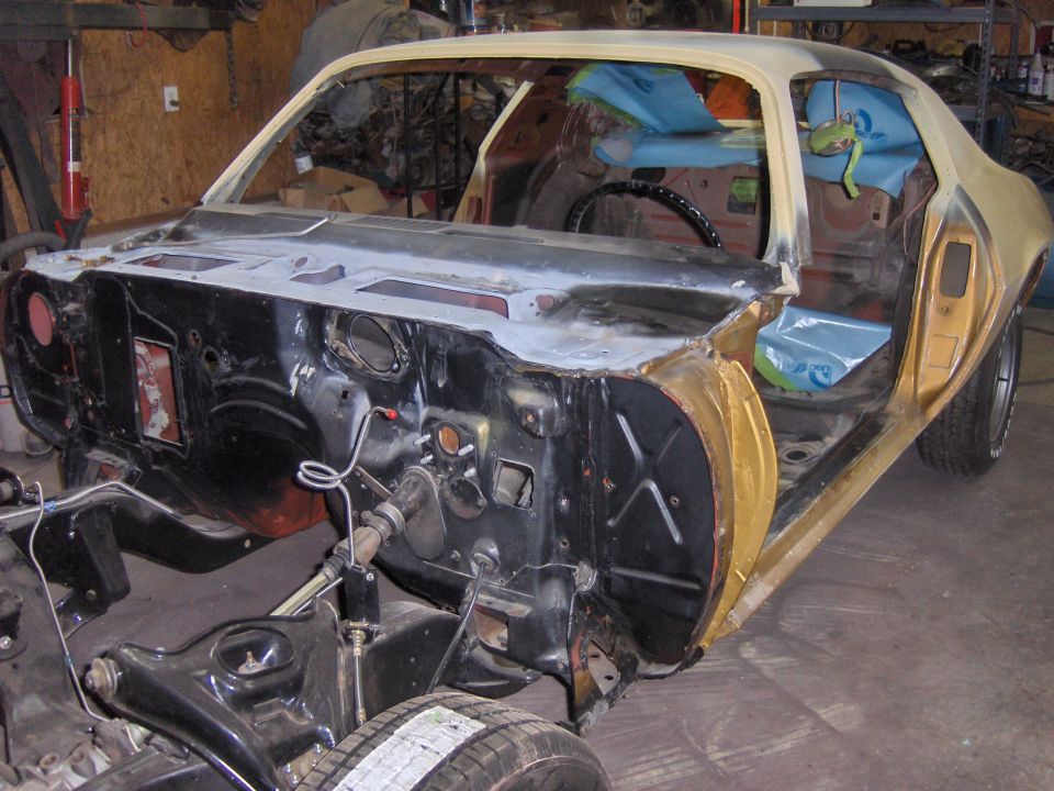 1970 Chevrolet Camaro body undergoing restoration, interior and engine bay exposed