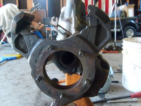 1994 Ford Bronco - A close-up of a vehicle spindle assembly is shown, with a black truck visible in the background.
