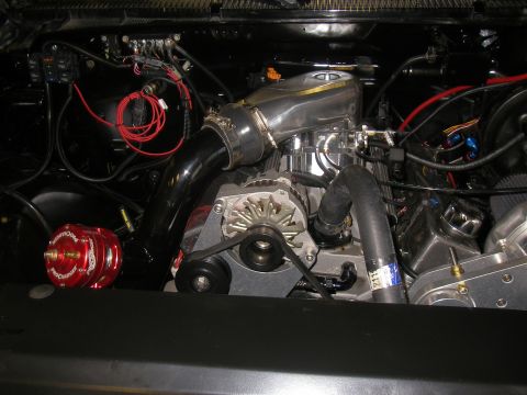 1990 Ford Bronco - Custom engine bay modifications include a supercharger and polished intake manifold.