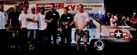 1992 Ford Mustang - A group of men stand near a drag car decorated with a star insignia.