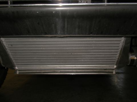 1990 Ford Bronco - Close-up of an aftermarket intercooler, likely installed on a performance vehicle.