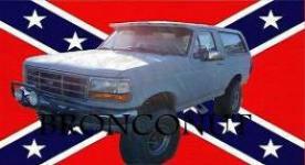 1995 Ford Bronco - A gray Ford Bronco is shown from the front-right, superimposed over a Confederate flag.