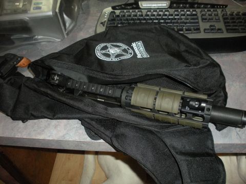 1996 Ford Bronco - A tactical rifle is partially visible inside a black bag with law enforcement insignia.