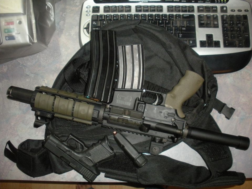 Assault rifle with two magazines and a handgun