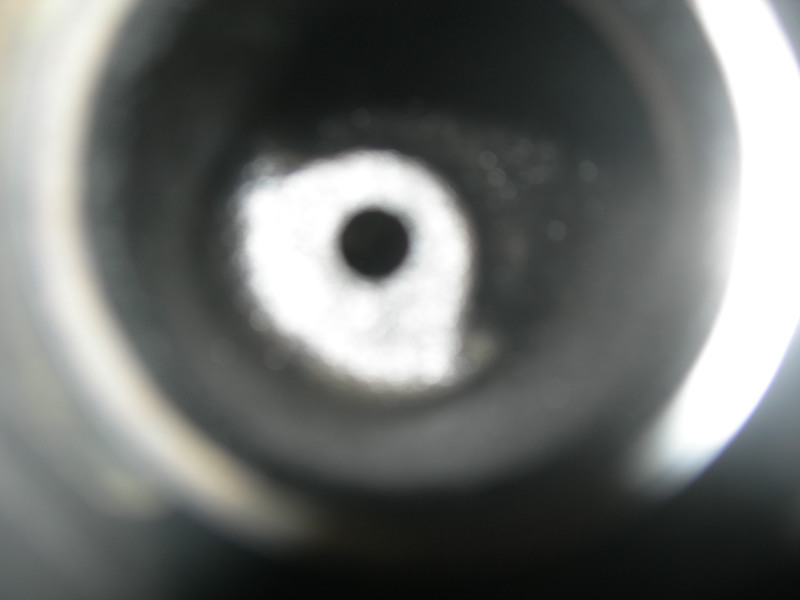 Cylinder bore with a central dark hole and bright outer ring