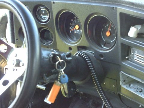1976 Chevrolet C/K Pickup - Close-up of the dashboard gauges and steering wheel, showing the odometer reading.