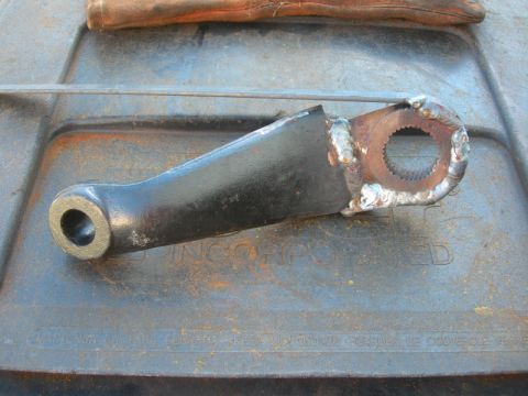 1984 Ford Bronco - A close-up view of a welded steering linkage part, likely for a vehicle rebuild.