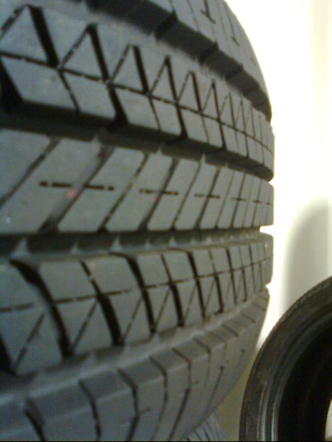 1989 Ford Probe - A detailed view of the tread on a tire, with another tire visible in the background.