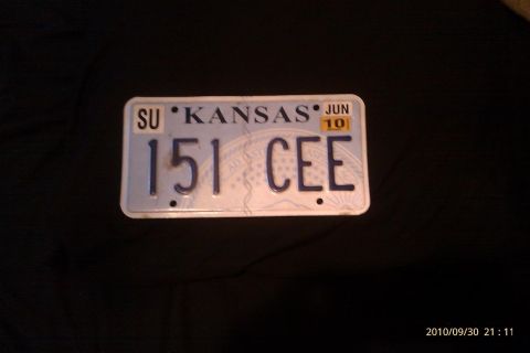 2000 Mercury Grand Marquis - A Kansas license plate with the number 151 CEE is shown against a dark background.