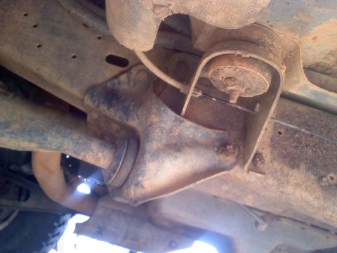 1990 Ford Bronco - Close-up of the undercarriage shows rusty suspension components and a Supermotors.net watermark.