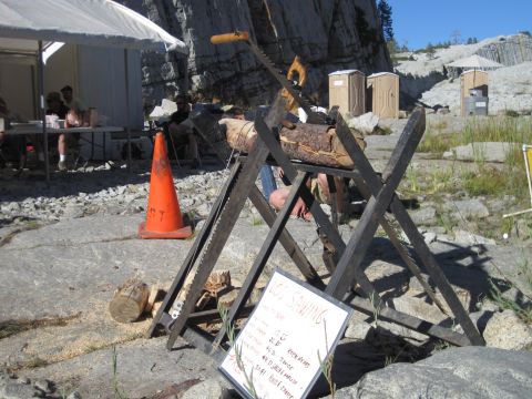1989 Ford Bronco - Log sawing equipment set up outdoors with a sign detailing information about the activity.