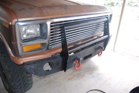 1982 Ford Bronco - Pickup truck front end with custom bumper and grille guard. Grille style indicates an early 1980s model.