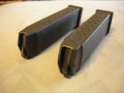 1996 Ford Bronco - Two pistol magazines are shown on a textured surface.