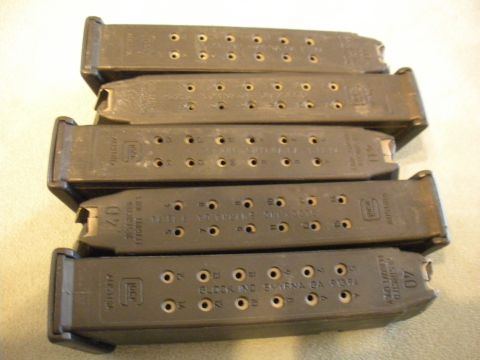 1996 Ford Bronco - Five Glock magazines are stacked, with markings indicating they are for 40 caliber ammunition.