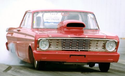 1963 Ford Fairlane - This 1963 Ford Fairlane is captured mid-burnout, its grille clearly visible.