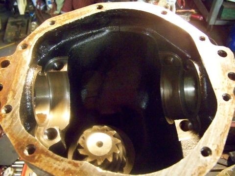 1989 Ford Bronco - Close-up view of a vehicle's differential housing, revealing internal gears and bearing surfaces.