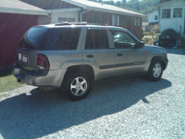 Silver 2003 Chevrolet TrailBlazer parked on gravel