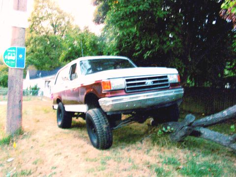 1989 Ford Bronco - This 1989 Ford Bronco is shown with a lifted suspension and large off-road tires.