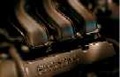 2000 Ford Taurus - Close-up of engine components, showing a manifold with some text.