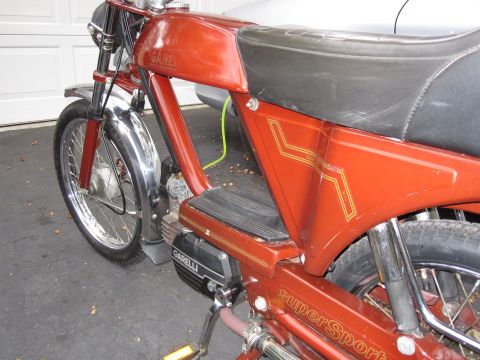 1981 Garelli Rally Sport - A close-up view of a red Garelli moped, showing its side profile and engine details.