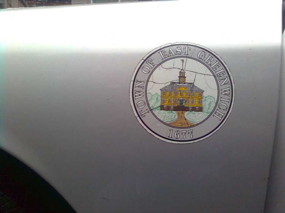 Town of East Greenwich 1677 seal decal on silver vehicle door panel