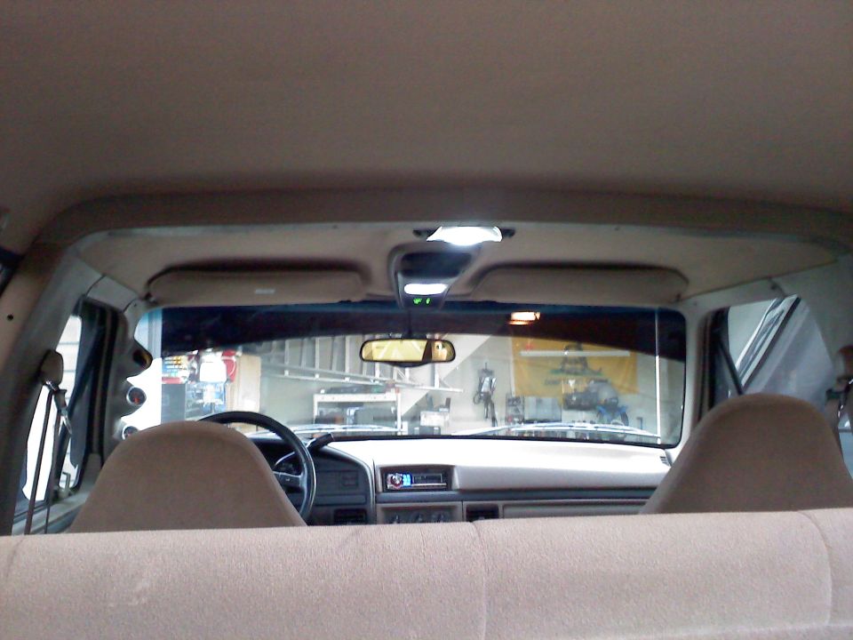 Interior view of truck cab showing dashboard and seats
