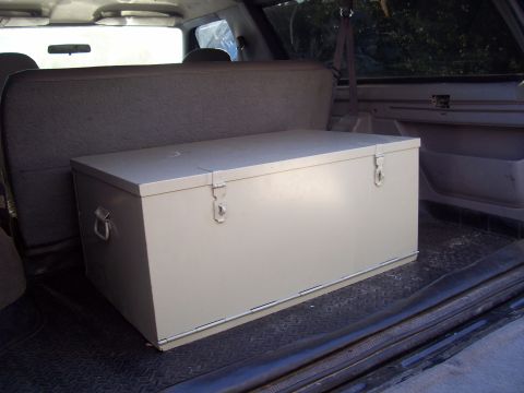 1994 Ford Bronco - Storage chest positioned behind the rear seat in the cargo area of an SUV.