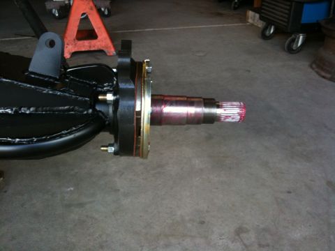 Suzuki Samurai - A close-up view of a vehicle's rear axle assembly, showing the spindle and brake mounting area.