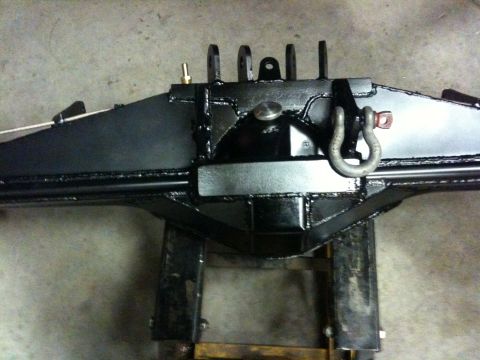 Suzuki Samurai - Rear axle assembly with integrated tow hooks and a small brass fitting is shown.