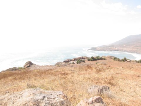 1986 Ford Bronco - Ocean view from a cliffside overlooking a bay with distant hills.