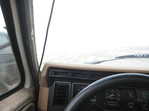 1986 Ford Bronco - View from the driver's seat of a 1986 Ford Bronco, showing the dashboard and gauges.