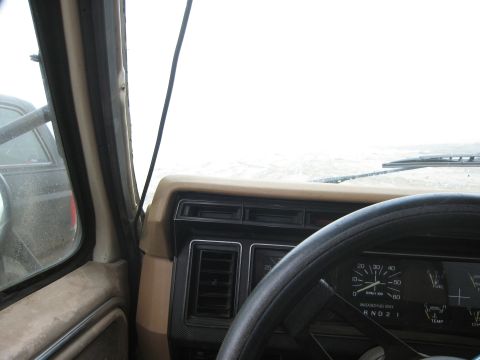 1986 Ford Bronco - Interior view of a 1986 Ford Bronco, including the dashboard and steering wheel.