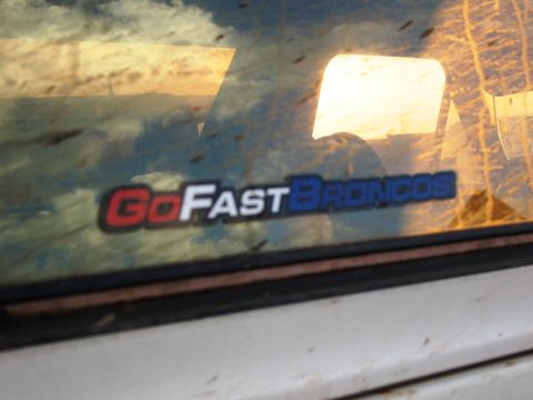1986 Ford Bronco - A sticker reading "GoFastBroncos" is visible on the rear window of a vehicle.